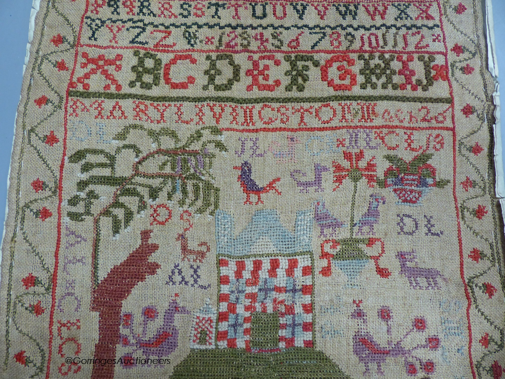 A cross stitch sampler, 41cm high, 29.5cm wide